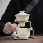 High-end ceramic automatic tea set home living room tea brewing set Kung Fu tea cup magnetic teapot lazy tea brewing artifact