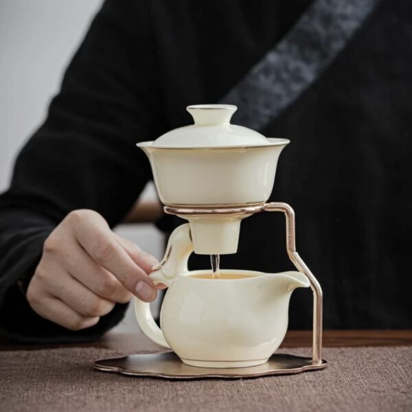 High-end ceramic automatic tea set home living room tea brewing set Kung Fu tea cup magnetic teapot lazy tea brewing artifact