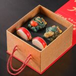 Creative Chinese style lion ornaments with gold and good persimmons, a pair of gift boxes